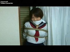 Teen floozy in a fetish schoolgirl uniform
