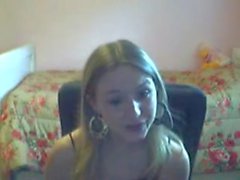 Young blonde girl teases and masturbates