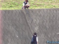 Teen asians pee outdoors