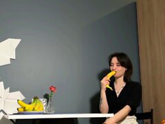 Teen girl using banana to cum