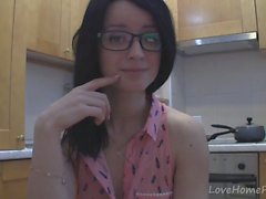 Splendid teen with glasses chatting in the kitchen