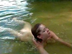 Beautiful girl sexy swim in the lake