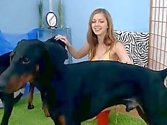 Cute teen spunky bee plays with her dogs